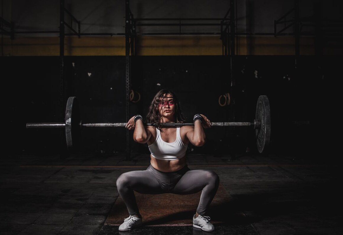Woman on treadmill cardio versus strength training weights