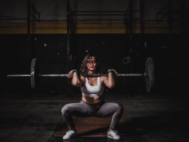 Woman on treadmill cardio versus strength training weights
