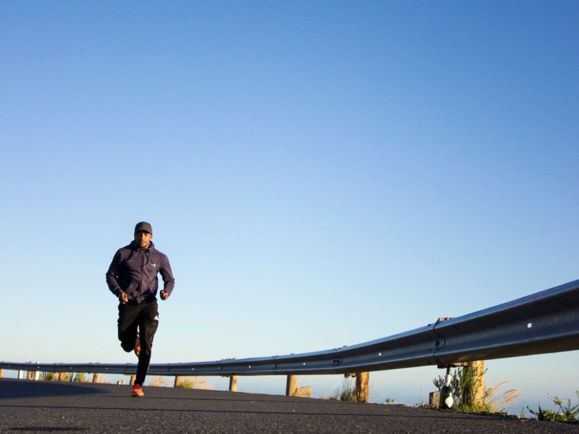 Person running outdoors HIIT workout