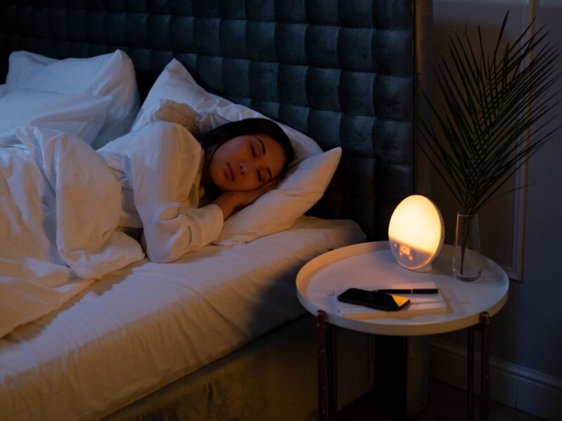 Woman sleeping peacefully on a soft pillow at night