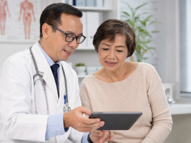 Person consulting a doctor about prediabetes blood sugar test results