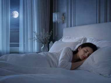 Person sleeping soundly in a peaceful bedroom representing the connection between sleep and heart health