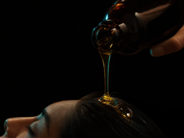 Castor oil for hair growth - dark cinematic castor oil editorial
