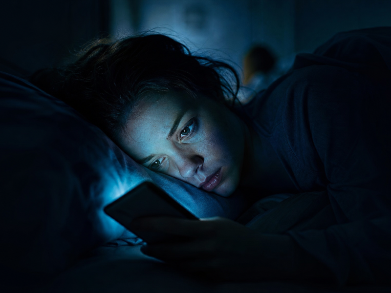 Blue light and screens affecting sleep - phone screen at night
